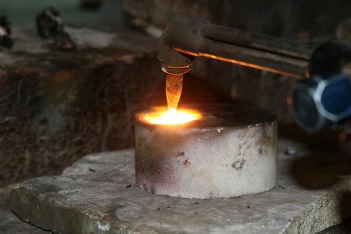 Molten metal being poured in a foundry