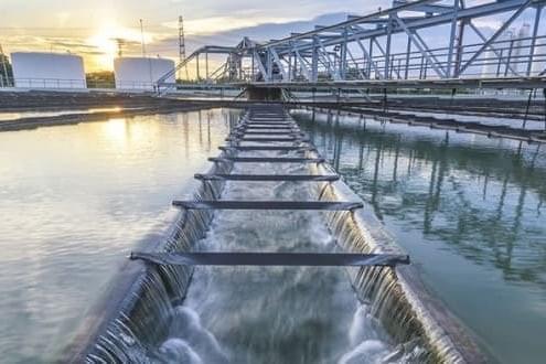 Water treatment plant aeration channel at sunset